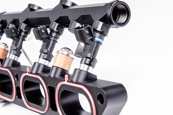 Radium port injection rail with phenolic isolation, sold by Tuned By Shawn