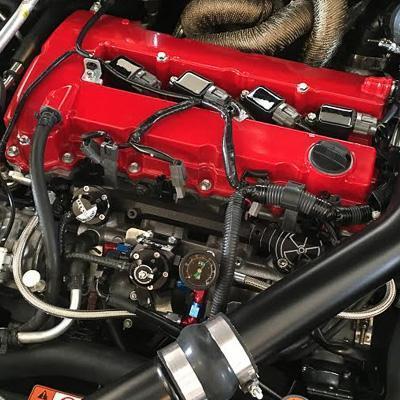 Anodized Radium fuel rail installed on Evo X 4B11T engine, sold by Tuned By Shawn