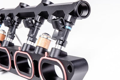 Radium port injection rail with phenolic isolation, sold by Tuned By Shawn